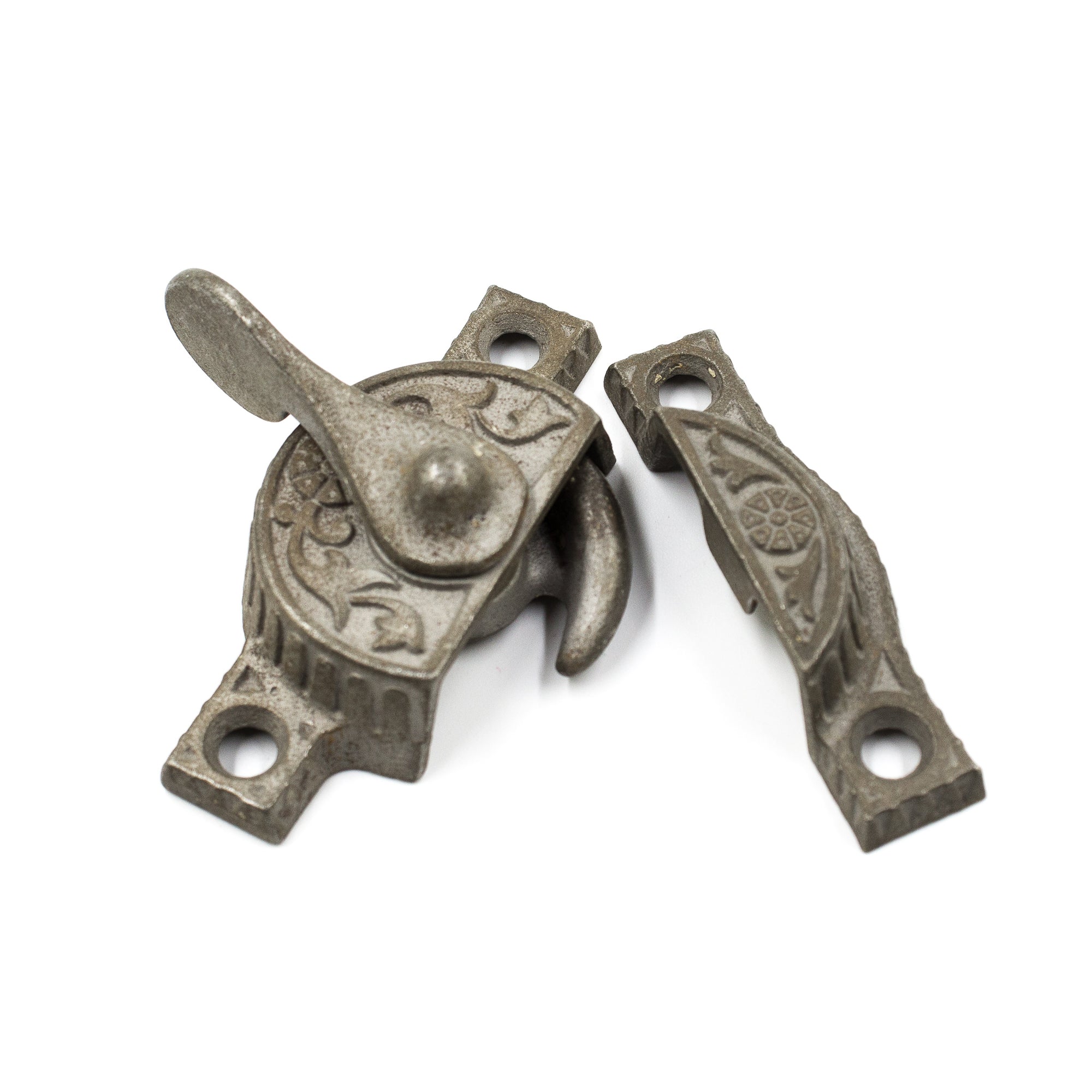 this is an antique victorian sash lock with a floral pattern