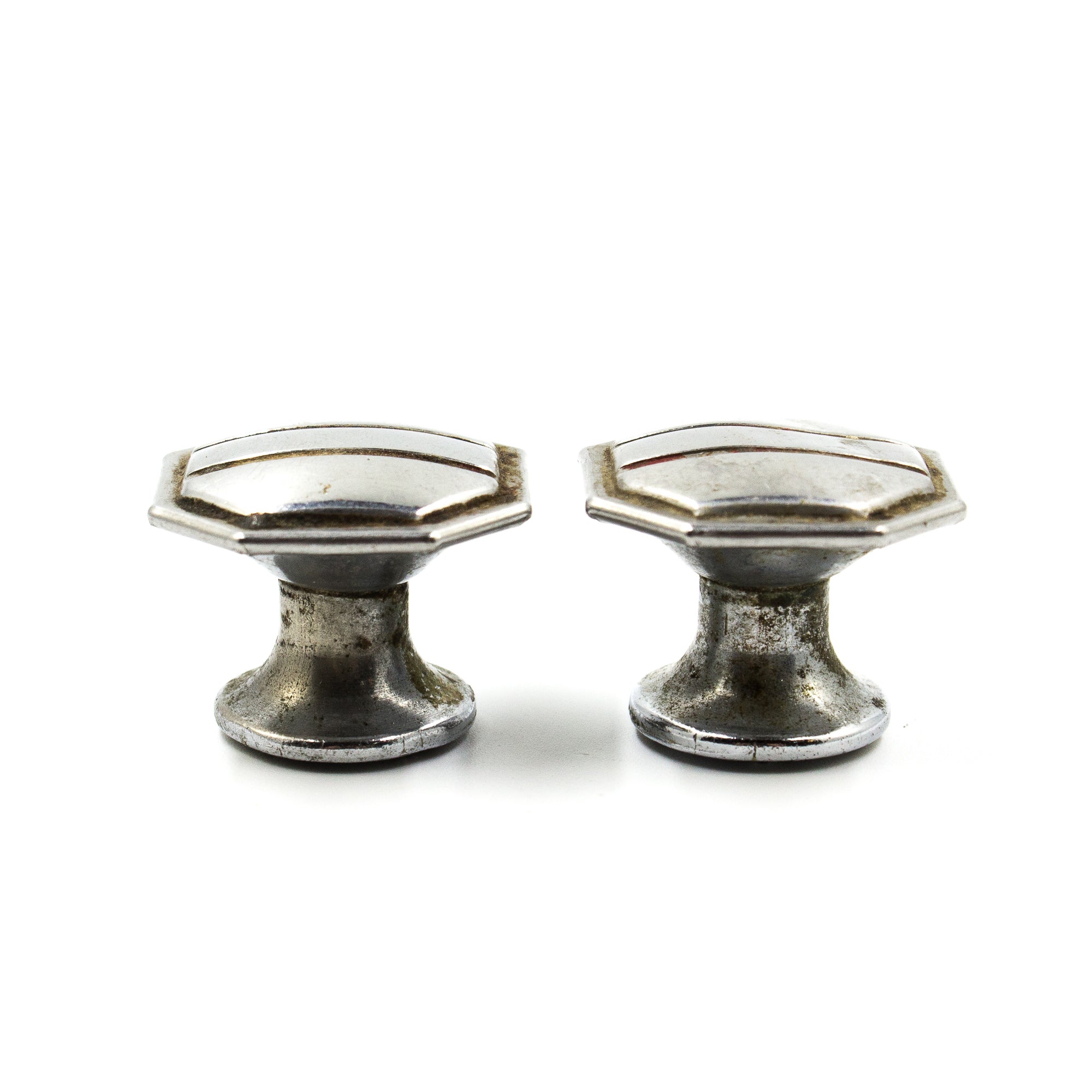 this is the side view of a pair of vintage mid century cabinet or drawer pull knobs