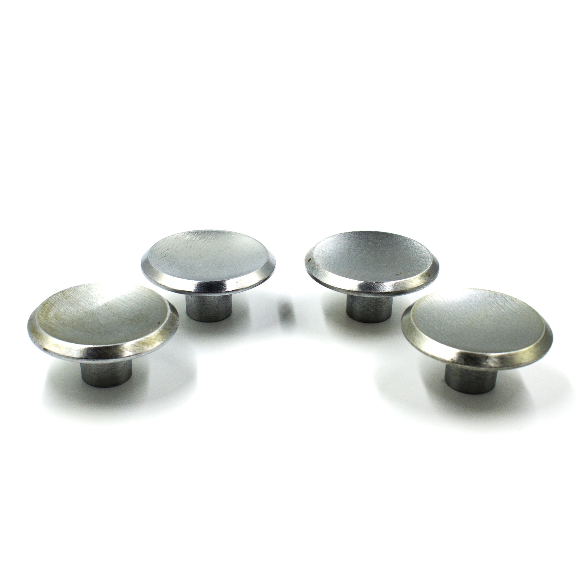 this is the side view of a set of four vintage mid century brushed nickel cabinet or drawer pull knobs