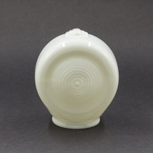 this is the back of a white glass sconce shade showing a ringed pattern