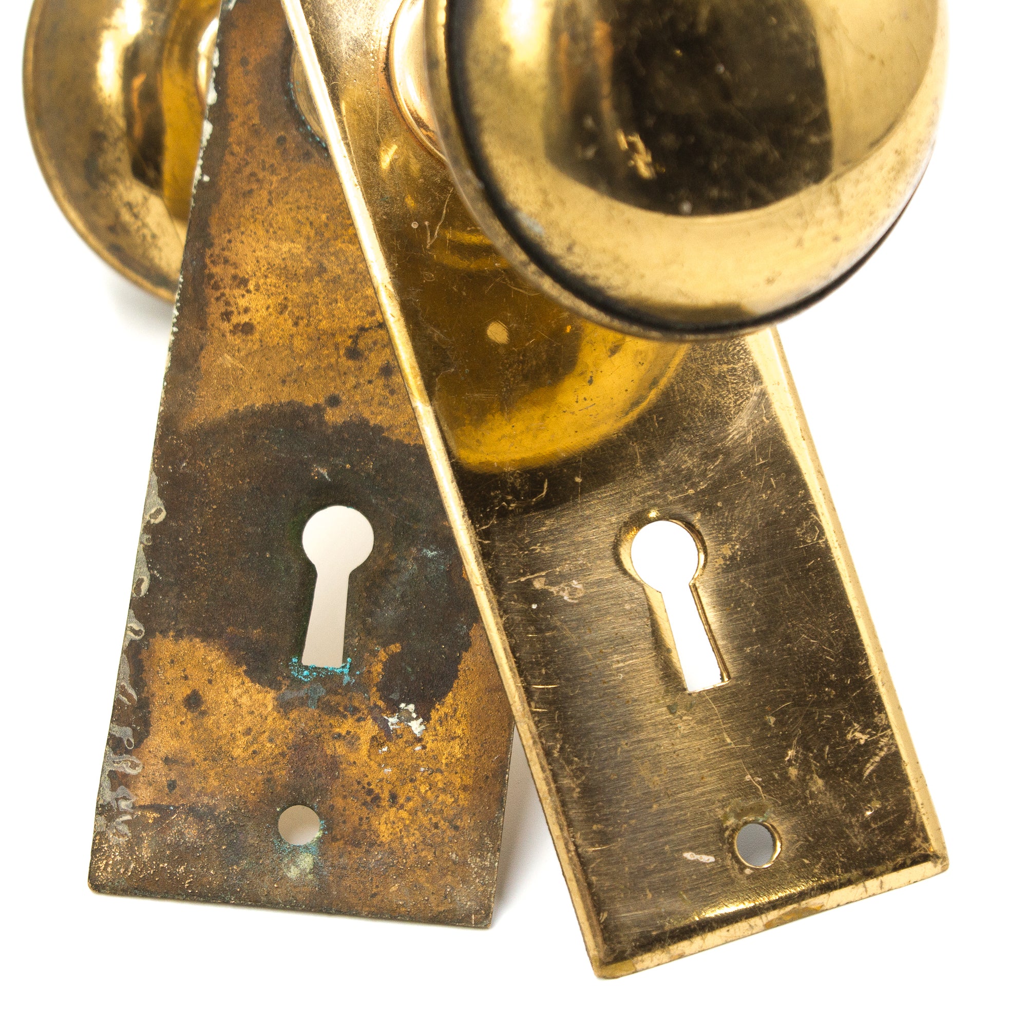 this is a vintage bronze doorknob set with backplates