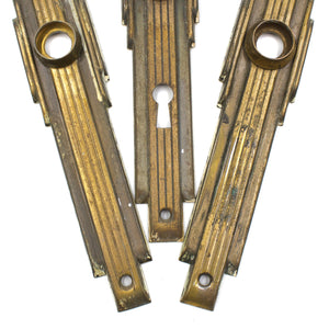 this is a close up picture showing the detail on a set of three vintage mid century art deco escutcheons