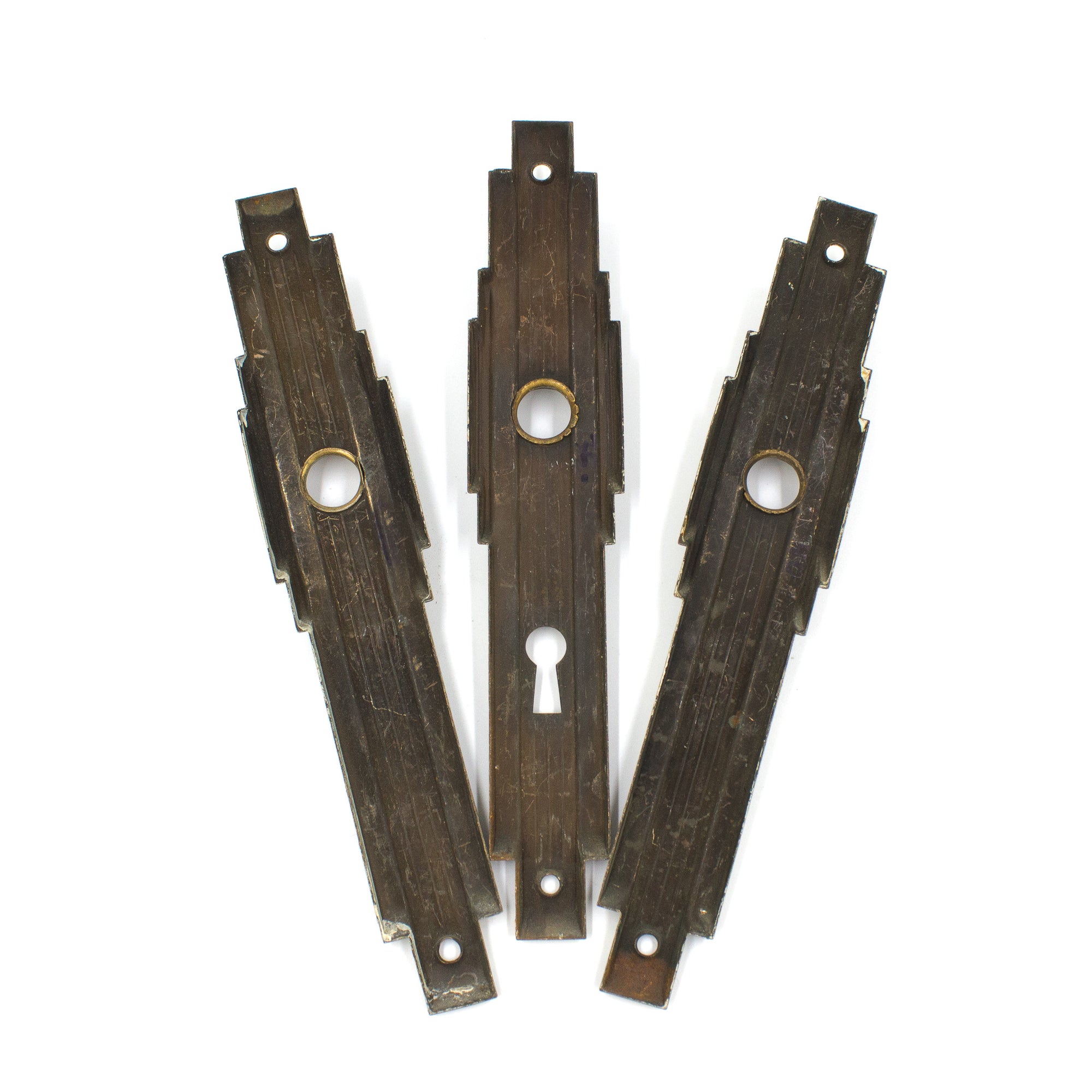 this is a picture of the backs of a set of three vintage mid century escutcheons 