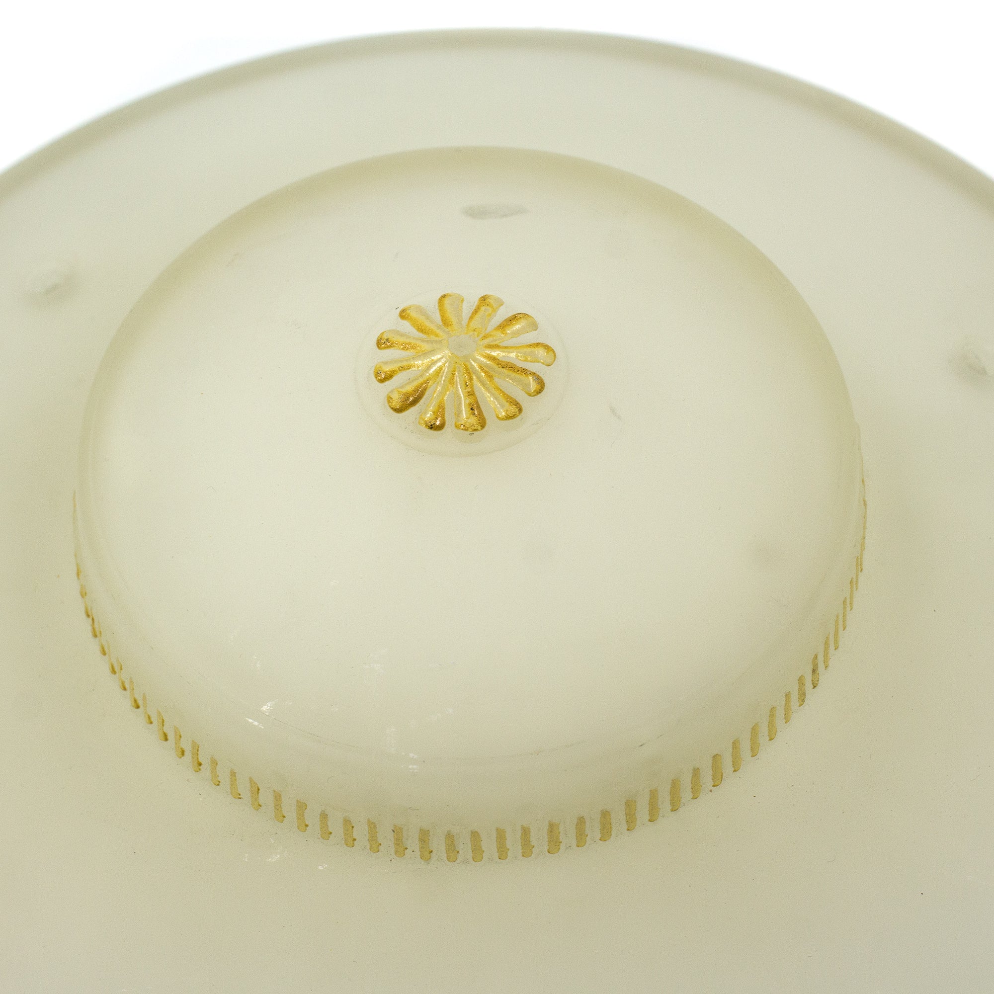 this is a close up picture of the yellow floral detail on a vintage mid century frosted glass three chain shade