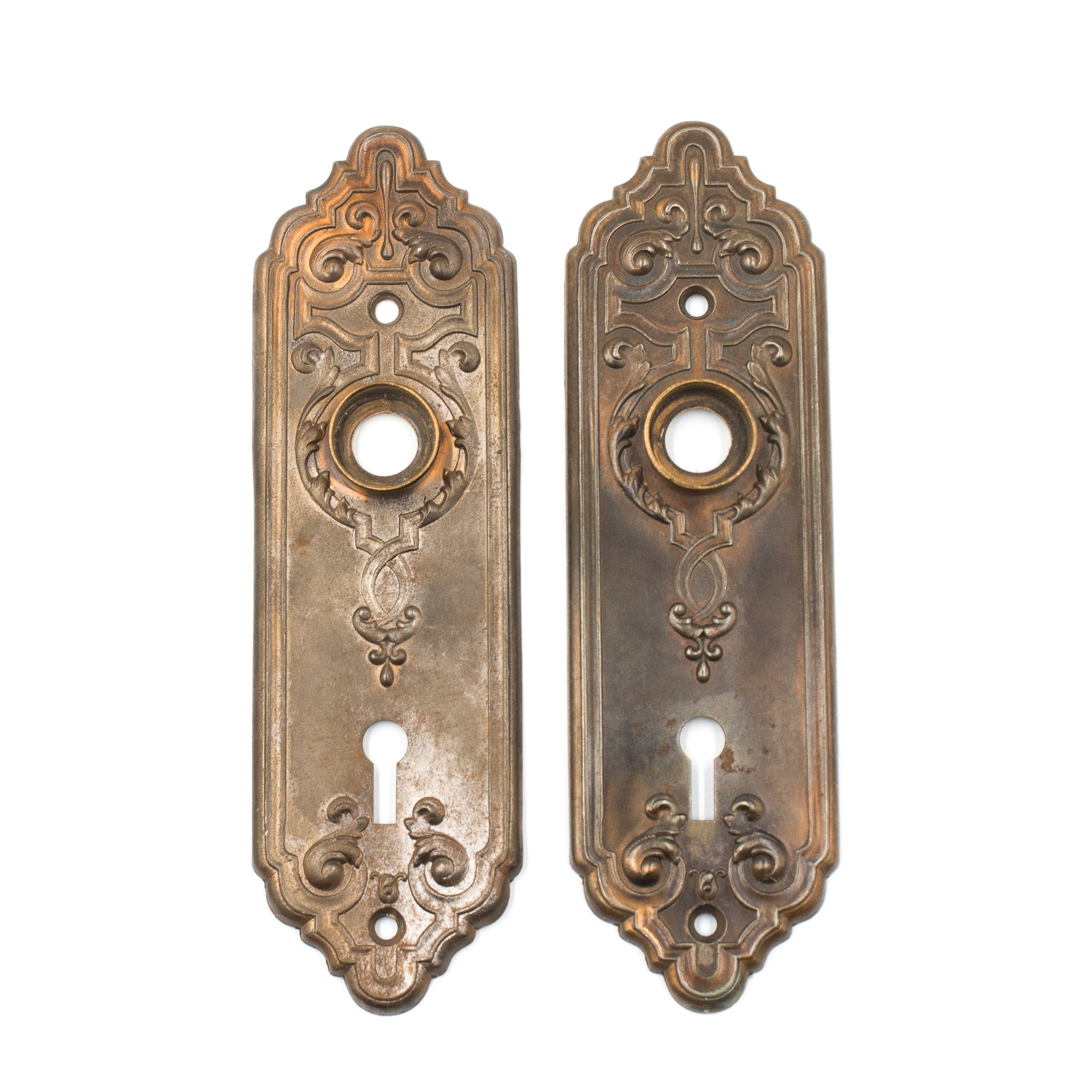 this is a pair of two antique bronze coated corbin escutcheons