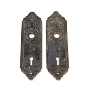 this is the backsides of a pair of antique escutcheons