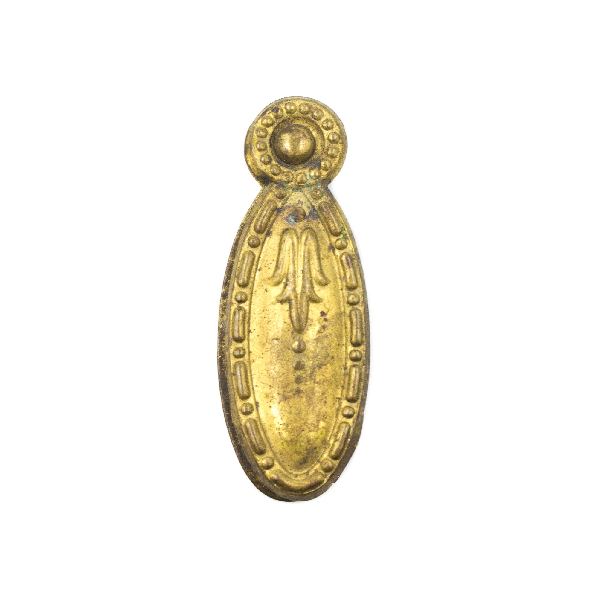 this is a picture of an antique vintage brass floral designed keyhole cover showing the hole covered