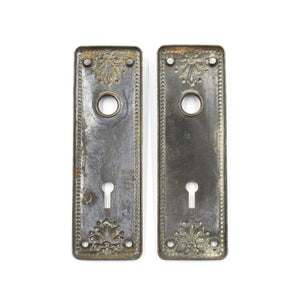 this is the backside of a pair of antique victorian escutcheons