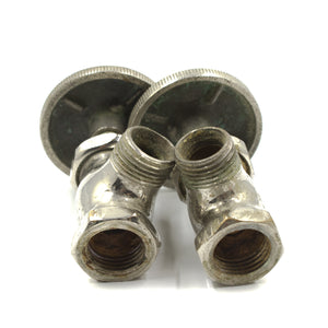 this picture shows a side angle of a pair of vintage pubco shut off valves