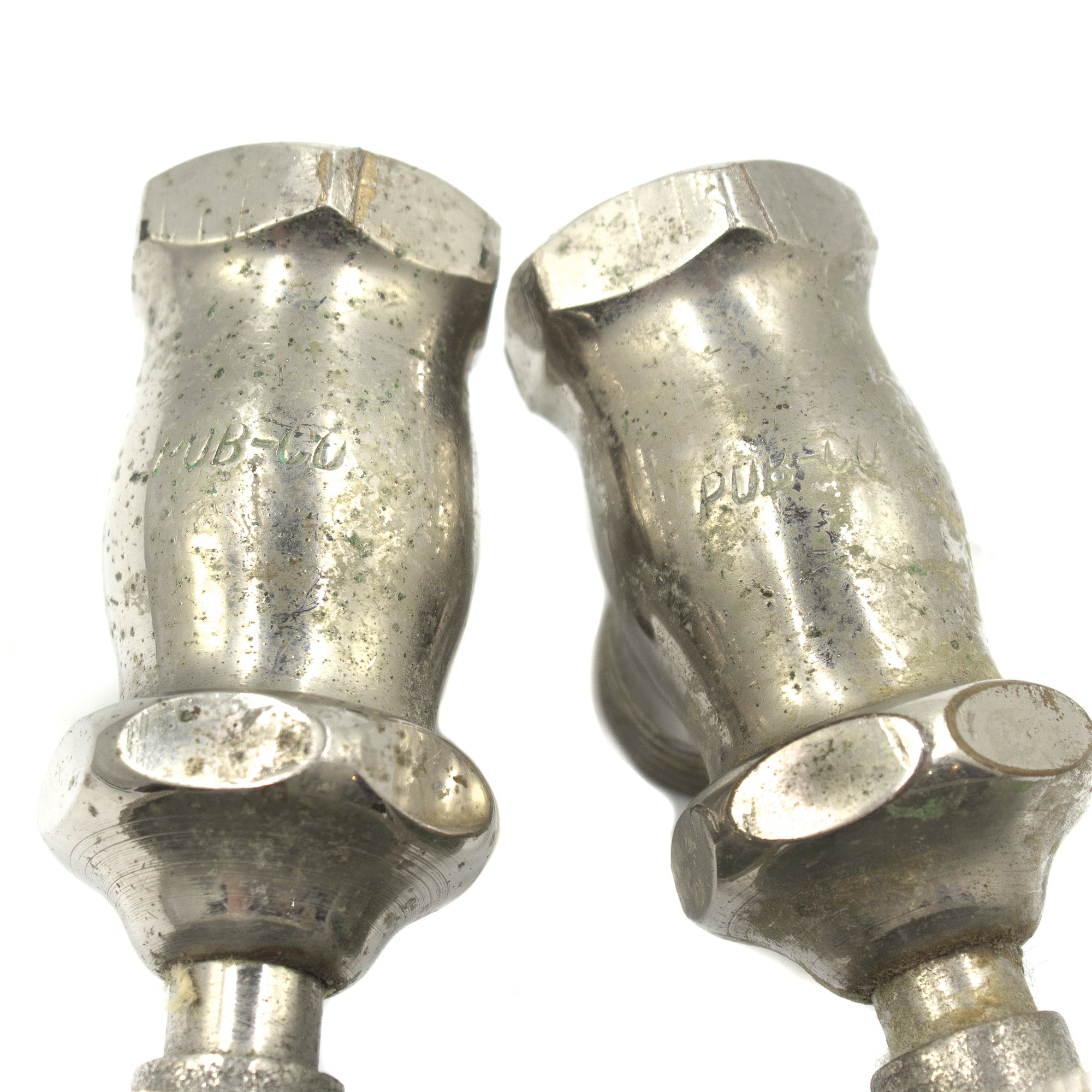 this picture shows the brand name Pub-Co on a pair of vintage shut off valves