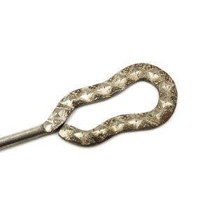 this is a close up picture of the handle on a vintage button hook