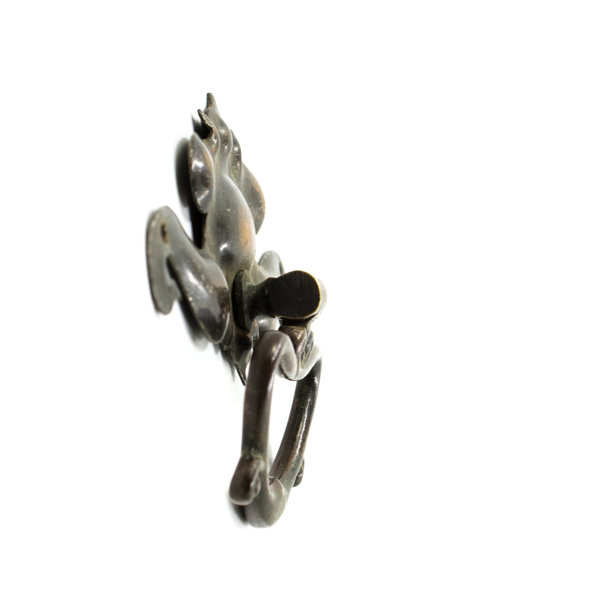 this is a profile view of a vintage art nouveau drawer bail pull