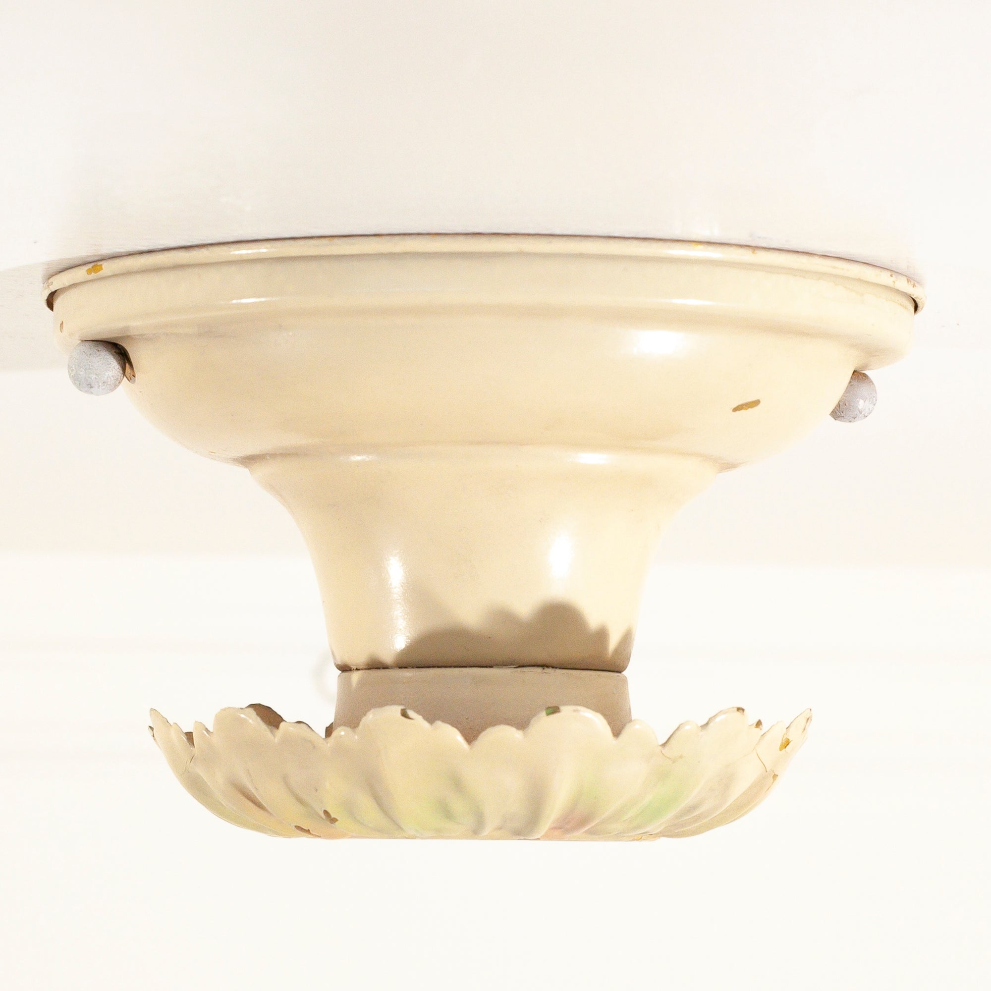 this is a side view of a vintage bare bulb ceiling fixture