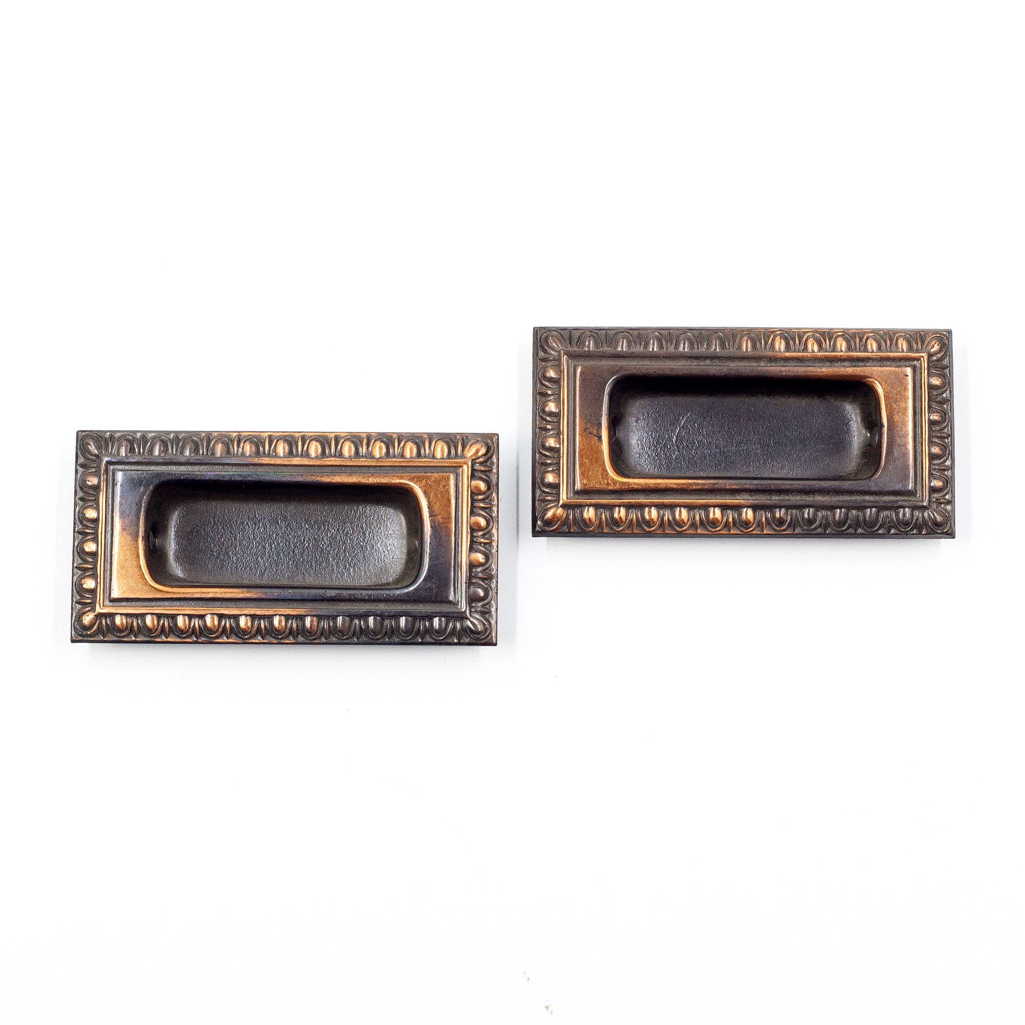 this picture shows a pair of antique japanned copper flash window lifts