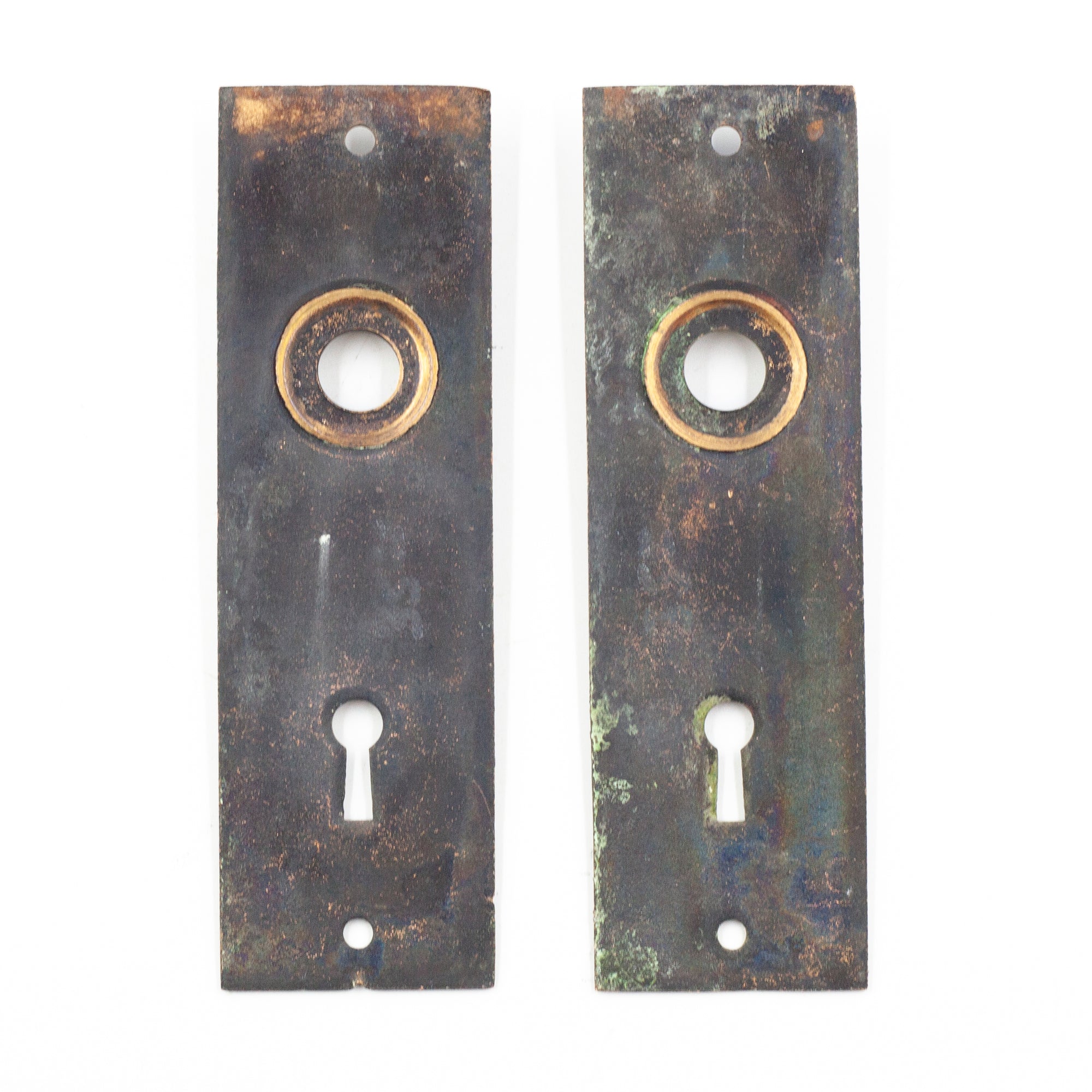 this is a picture of the back of a pair of vintage copper flash japanned escutcheons