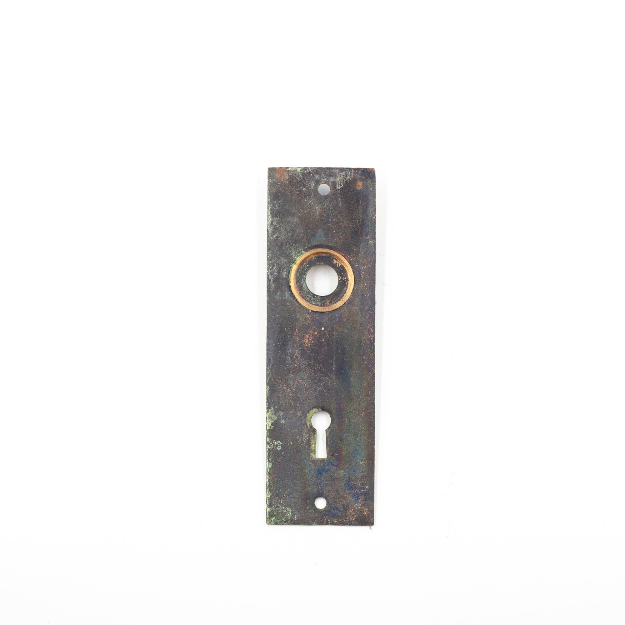 this is a picture of the back of a single vintage escutcheon