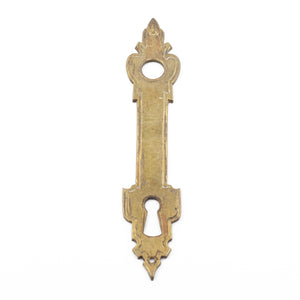 this is an antique vintage brass escutcheon with a smooth finish