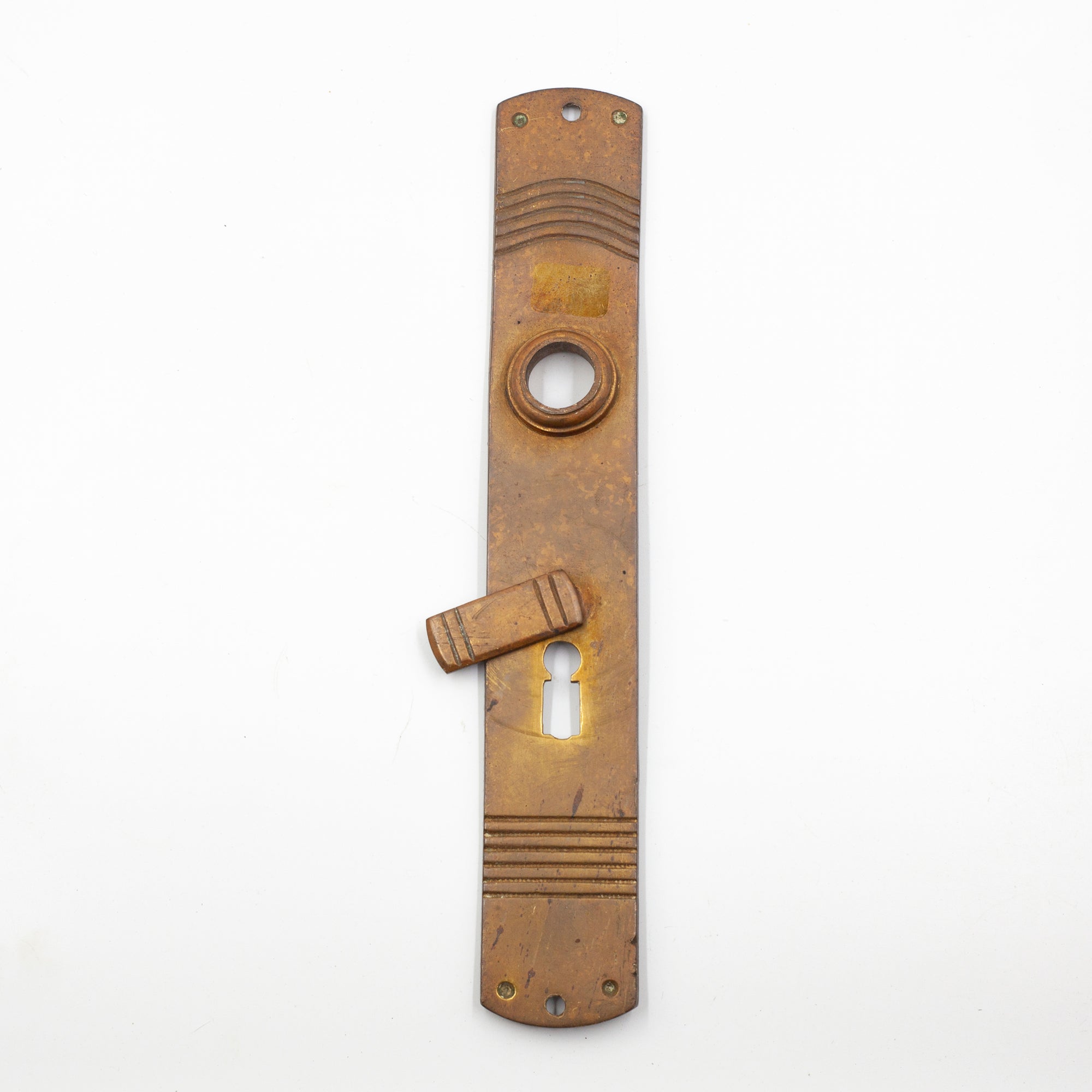 this is a slim vintage brass escutcheon with keyhole cover and a striped pattern