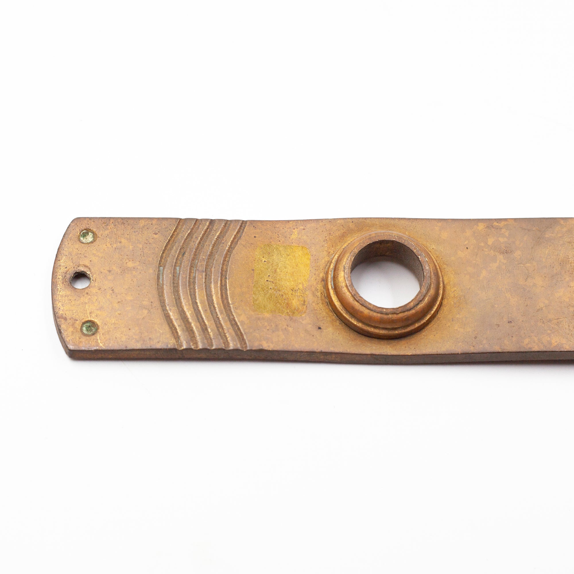 this picture shows the top half of a vintage brass escutcheon