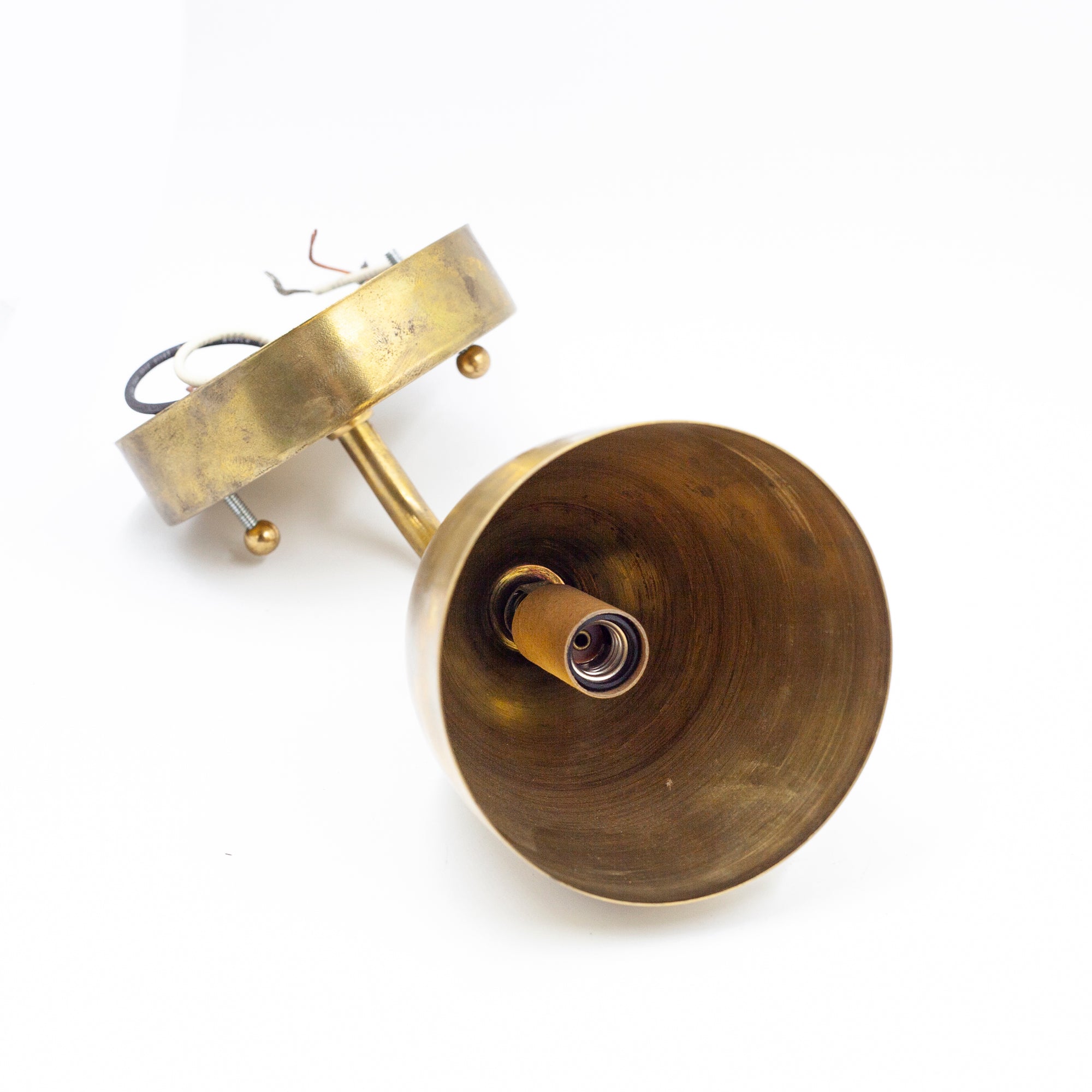 this is a picture of the inside of an antique brass sconce. It shows the inside of the socket